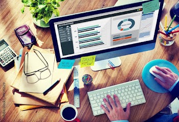 Man Working in the Office Regarding Accounting