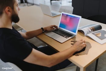 Man working on his laptop | Free stock psd mockup - 488511
