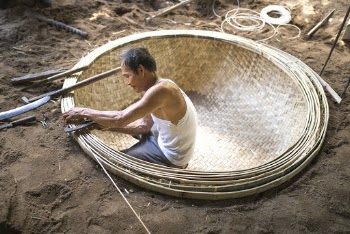 Man Woving Basket