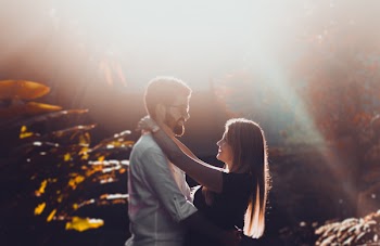 Man Wrapped His Hand Around Woman's Waist While Staring Each Other