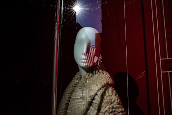 Mannequin Wearing Brown Coat