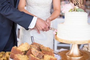 Married Couple Cutting Cake Together