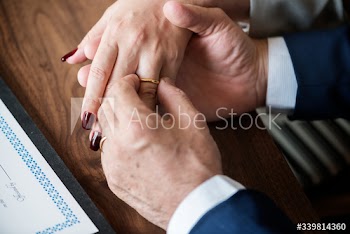 Married elderly couple with rings