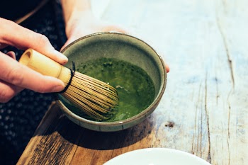 Matcha tea whisking 