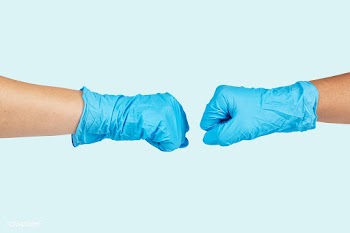 Medical staff bumping fists to support each other during coronavirus p.. | Free  psd mockup - 2294596