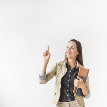 Medium shot business woman pointing with copy space Free Photo