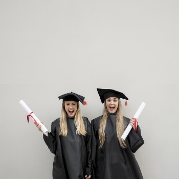 Medium shot happy girls graduating Free Photo