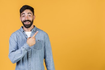 Medium shot happy guy pointing up Free Photo