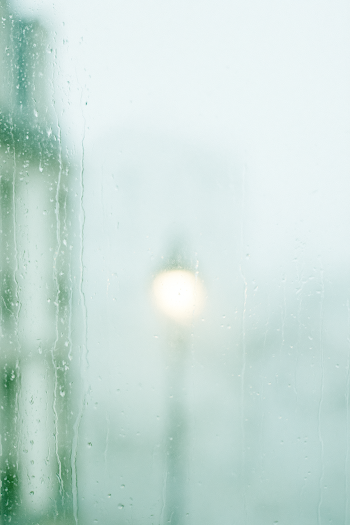 Melancholic Rainy Window with Soft Glow