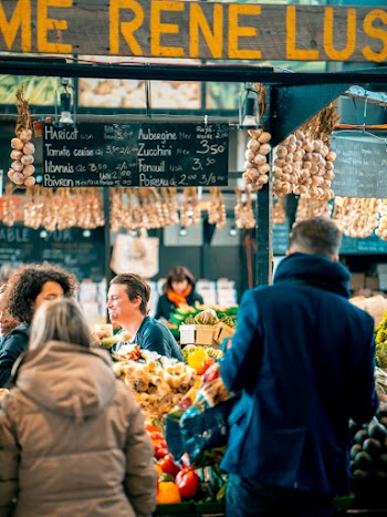 Men and Women Around a Vegetable and Fruit Market