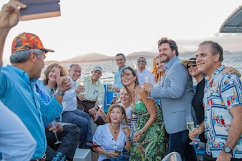 Men and Women Taking Group Picture Using Smartphone