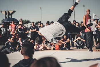 Men Dancing in Front of People