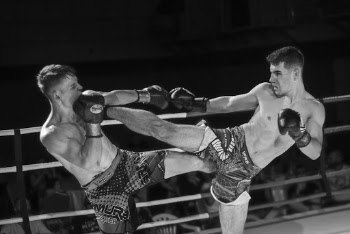 Men Fighting In The Ring