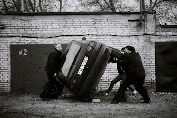 Men Flipping a Car