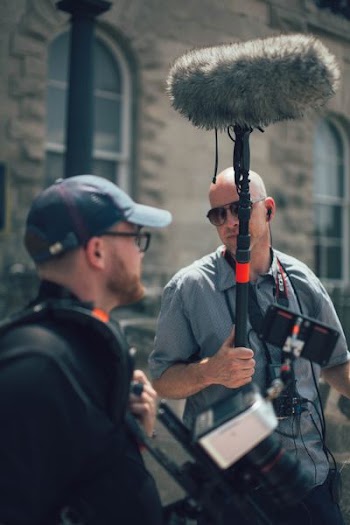 men getting ready to shoot a movie film