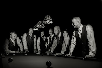 Men in Suit Standing Beside Billiard Pool