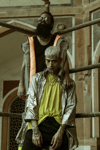 Men Leaning on Bar Frame