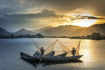 Men On Water Spreading Nets