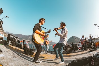 Men Playing Guitar and Violins