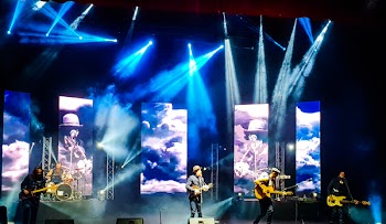 Men Playing Musical Instruments On Stage