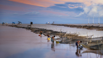 Men Preparing Their Boats for Fishing