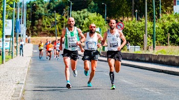 Men Running on Asphalt Road