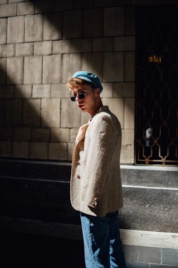 men's brown suit jacket and blue denim bottoms