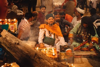 Men Sitting During A Celebration