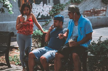 Men Sitting On Bench 