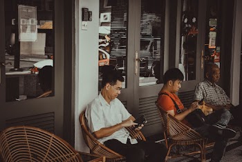 Men Sitting On Chairs