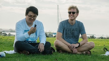 Men Sitting on Grass