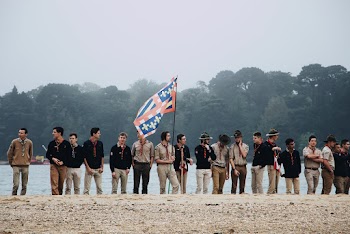 Men Standing Beside Body of Water