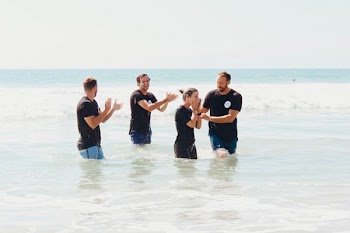 men standing in body of water