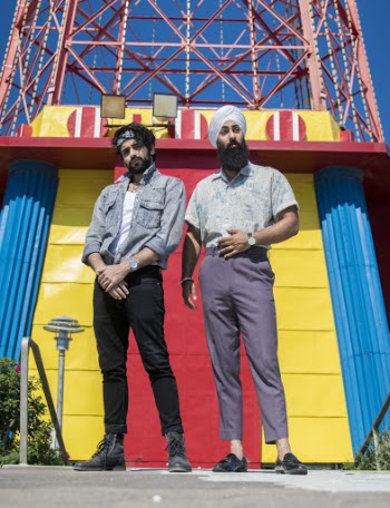 Men Standing In Front Of A Tower