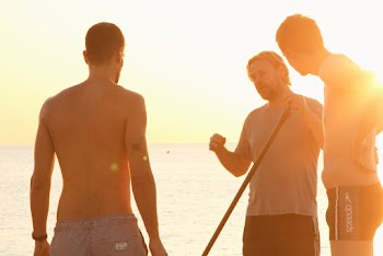 Men Standing Near Sea