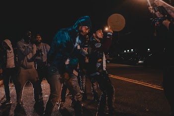 Men Standing On Road During Nighttime