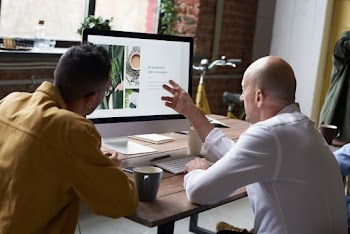 Men Using Imac Indoors