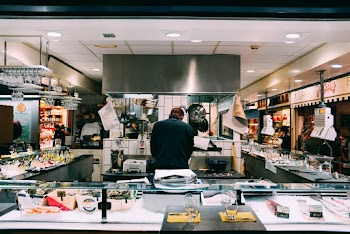 Men Wearing a Black Lapel in a Store