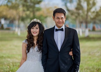 Men Wearing Black Suit Jacket and Woman Wearing White Wedding Gown