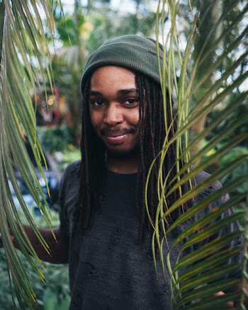 Men Wearing Grey Beanie Holding Green Leaves