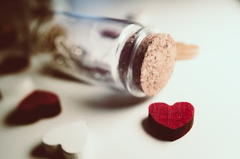 Message in a bottle and wooden hearts