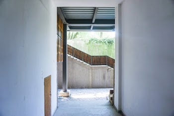 Metal Post in Between Concrete Corridor