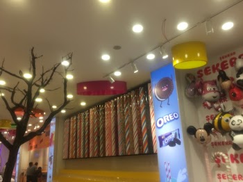 Mickey Mouse Balloon Beside Oreo Poster