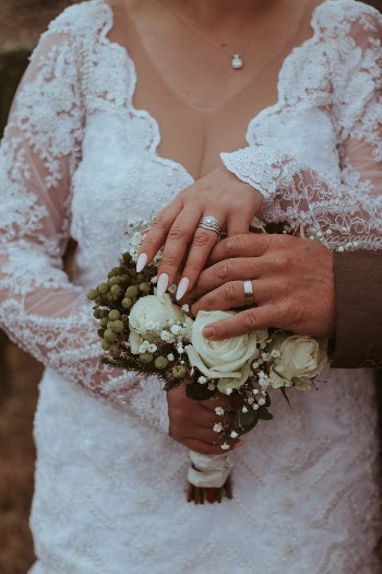 Midsection of Bride Holding Bouquet