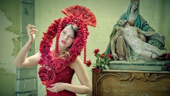 Midsection of Woman Wearing Red Flower