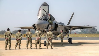 Military Personnel Observing F-35 Stealth Fighter Aircraft