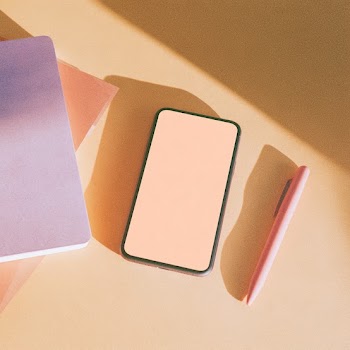 Minimal Flat-Lay Composition with Smartphone and Stationery