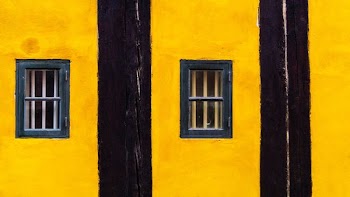 minimalist photography of black and yellow striped windows