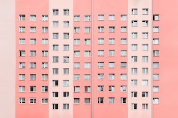 minimalist photography of pink high-rise building