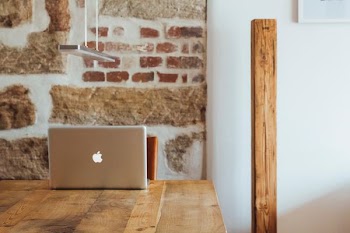 minimalist photography of silver MacBook placed on top of wooden table